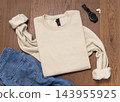 Blank beige folded sweatshirt mockup, crewneck flat lay with denim jeans and mens accessories 143955925