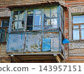 Dilapidated balcony of an old brick house 143957151