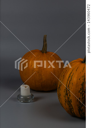 Pumpkins with a candle for Halloween celebration in autumn season Pumpkins with a candle for Halloween celebration in autumn season 143960472