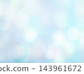 A background with soft, blurred light in a pale blue hue. 143961672