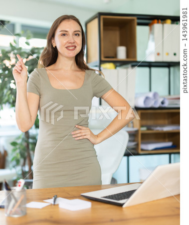 Woman sit close to table, speak in conference hall. Woman sit close to table, speak in conference hall. 143961981