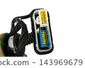 A modern car connector or trailer for closing an electrical circuit that a mechanic holds in gloves during repairs. 143969679