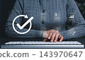 Document Approval and Quality Assurance Process Concept. Businesswoman working on computer with icons of document review and check mark, symbolizing document validation, compliance, approval workflow 143970647