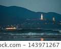illuminated Lady Buddha statue and Linh Ung Pagoda above coastline with sea waves and mountains in Da Nang, Coastal landscape with ocean waves and Son Tra Peninsula at night, Danang Vietnam 143971267