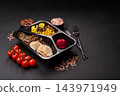A bowl featuring slices of boiled chicken fillet, buckwheat noodles, and mushrooms 143971949