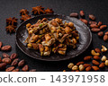 A bar of sugar free white chocolate with pistachios, almonds, and hazelnuts. A white chocolate bar 143971958