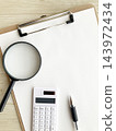 Clipboard and calculator, magnifying glass, pen - business, accounting, research image - accounting and calculations, document checking 143972434