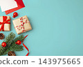 Christmas background with gift boxes and xmas ornament on blue background, top view 143975665