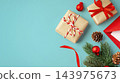Gift boxes and christmas ornaments on blue background, copy space 143975673