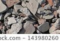 broken grey stone in the wall 143980260