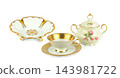 Vintage porcelain tea set with gold ornament teacup saucer sugar bowl and footed dish isolated on white background horizontal photo with copy space 143981722