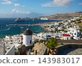 Mykonos town and harbor with a traditional windmill and cruise ships, Greece 143983017