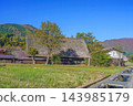 Shirakawa-go, a place where the original landscape of Japan remains, boasts a beautiful autumn day with stunning fall foliage and a nostalgic tourist scene. Shirakawa-go, a place where the original landscape of Japan remains, boasts a beautiful autumn day with stunning fall foliage and a nostalgic tourist scene. 143985179