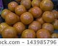 Persimmons sold at a market in Paris 143985796