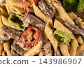 Pasta with Sliced Beef Steak Served on a Plate. 143986907
