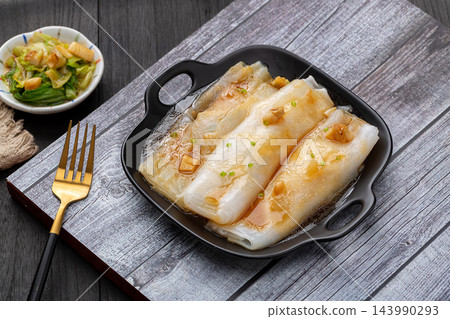 Traditional Cantonese steamed rice noodle rolls with dim sum shrimp dumplings 143990293
