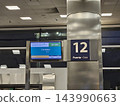 Buenos Aires, Argentina - October 14, 2026: Boarding gate 12 sign at Jorge Newbery Airport terminal 143990663