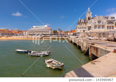 Fishing Boats in Cascais Harbor with Sandy Beach and Waterfront, Portugal Fishing Boats in Cascais Harbor with Sandy Beach and Waterfront, Portugal 143990967