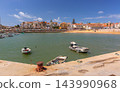 Fishing Boats in Cascais Harbor with Sandy Beach and Waterfront, Portugal 143990968