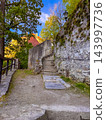 Old stone stairs ascend a hillside path in Cesky Krumlov, Czechia 143997736