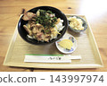 Local specialty: Tempura rice bowl with Awao chicken and bigfin reef squid. 143997974