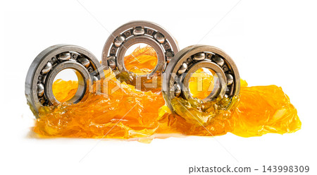 Ball bearing stainless with grease lithium machinery lubrication for automotive and industrial isolated on white background. Ball bearing stainless with grease lithium machinery lubrication for automotive and industrial isolated on white background. 143998309