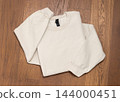 Blank beige unisex sweatshirt mockup, folded crewneck flat lay template with copy space 144000451