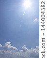 Blue sky with clouds and sun 144004382