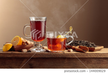 Black tea with lemon and brown sugar. 144009029