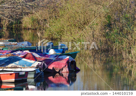 fishing boats moored in the stream fishing boats moored in the stream 144010159