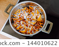 boiled forest mushrooms 144010622