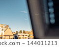 view daytime blue sky and moon through an open window 144011213