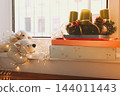 Advent wreath with candles and Christmas gifts 144011443