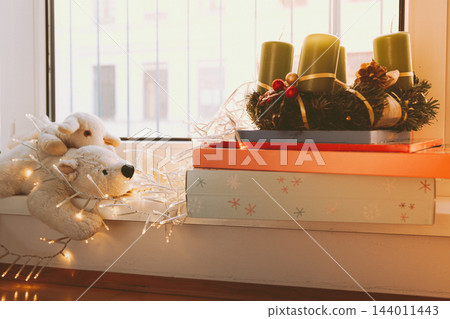 Advent wreath with candles and Christmas gifts Advent wreath with candles and Christmas gifts 144011443