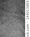 Wrinkled black denim fabric close up texture. 144013869