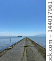 A seawall stretching straight out to sea against a clear blue sky; the gentle sea breeze of Nabematsubara, Tamana. A seawall stretching straight out to sea against a clear blue sky; the gentle sea breeze of Nabematsubara, Tamana. 144017961