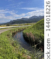 Blue sky and the Aso mountain range, a rural autumn landscape with waterways and pampas grass. Blue sky and the Aso mountain range, a rural autumn landscape with waterways and pampas grass. 144018226
