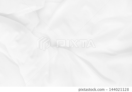 Close up top view of white bedding sheet and wrinkle messy blanket in bedroom after wake up in the morning. Close up top view of white bedding sheet and wrinkle messy blanket in bedroom after wake up in the morning. 144021128