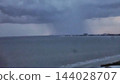 Tropical Storm and  rain  Clouds Over The Ocean 144028707