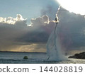 Rain Clouds of Pink, Blue Gray, Grey Sky On The Beach 144028819