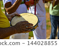 Tambourine player capoeira 144028855