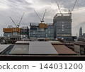 a new multi-tiered commercial development rising along Rama III Road on the historic site of the former Tawandang German Brewery. Towering construction cranes, multi-layered glass facades, and 144031200
