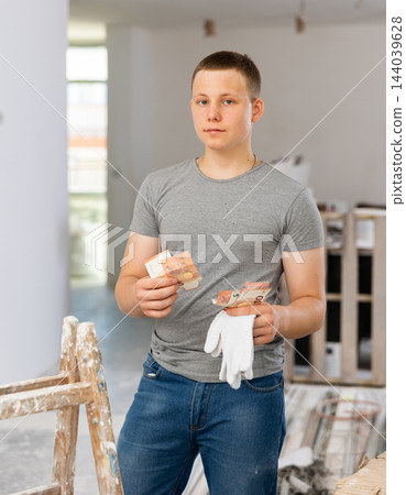 Fifteen-year-old teenager counting the first salary 144039628