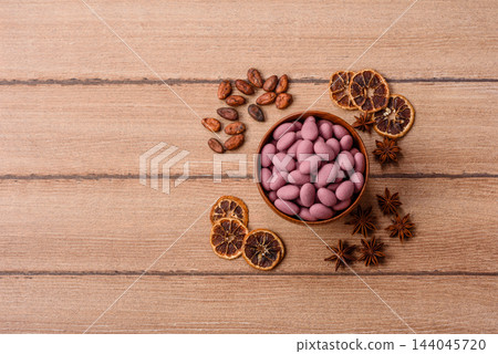 Pink, matcha and rose flavored candy, coated peanuts. Sweet, sugar coated peanuts Pink, matcha and rose flavored candy, coated peanuts. Sweet, sugar coated peanuts 144045720