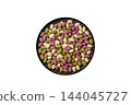 Sweet, candy coated peanuts in pink, green and white colors. Sugared peanuts 144045727