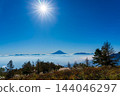 Mount Fuji floating above a sea of clouds at sunrise, as seen from Mount Amari in autumn. 144046297