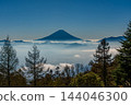 Mount Fuji floating above a sea of clouds at sunrise, as seen from Mount Amari in autumn. 144046300