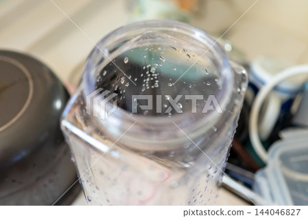 White spots that won't come off even after washing a plastic iced tea pot. White spots that won't come off even after washing a plastic iced tea pot. 144046827
