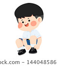 Cute boy student in school uniform tying his black shoelaces 144048586
